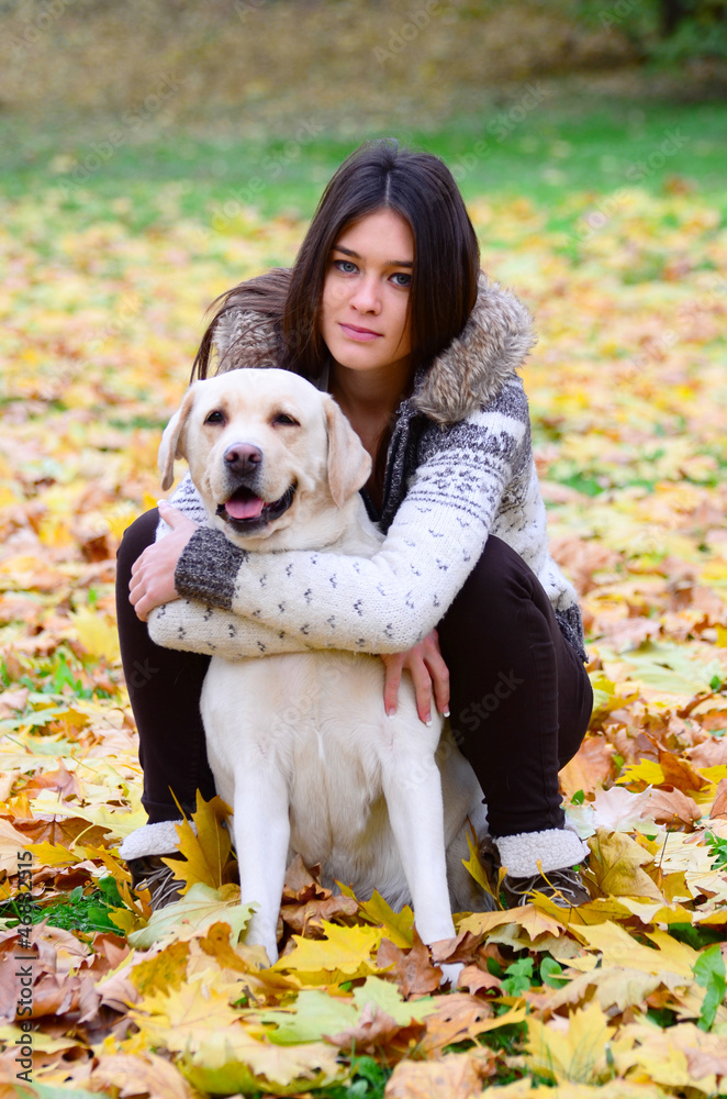 Brunette girl with dog in nature Brunette girl with dog in nature