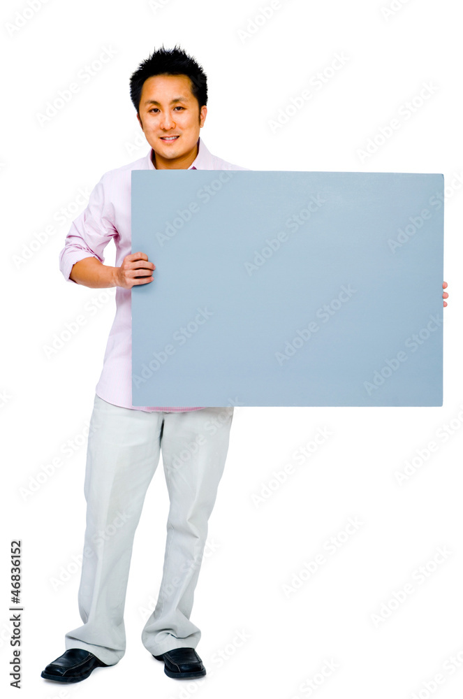 Young man showing placard Young man showing placard