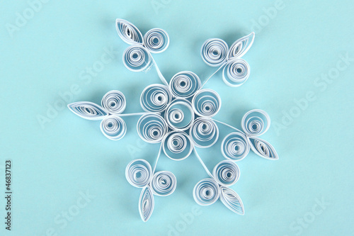 beautiful paper snowflake, on blue background