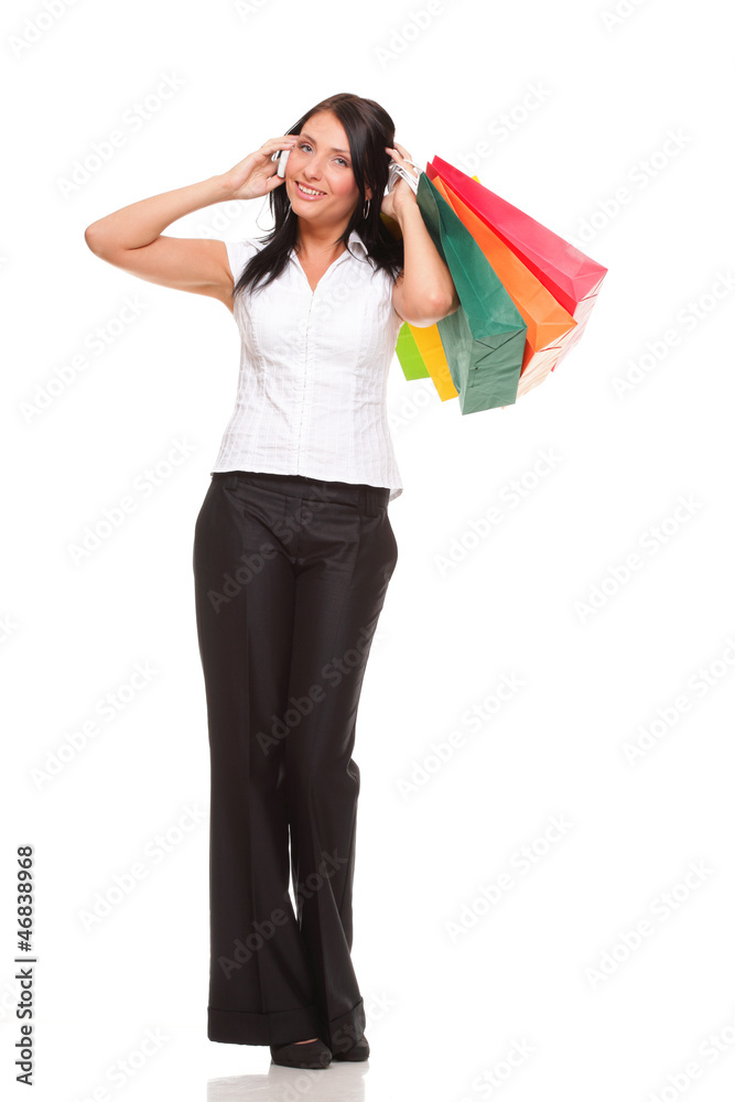 portrait cute young woman mobile phone while holding shopping ba portrait cute young woman mobile phone while holding shopping ba