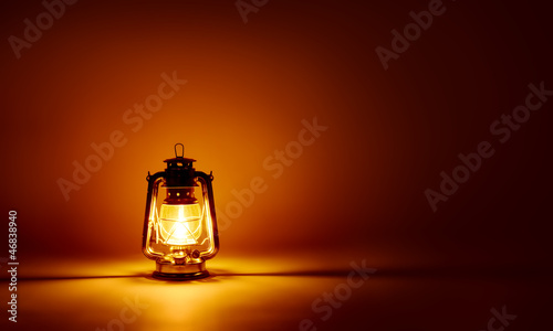 Burning kerosene lamp background, concept lighting photo