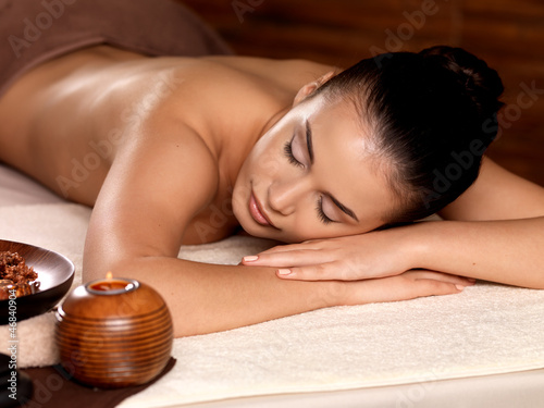 Calm woman relaxing in spa salon