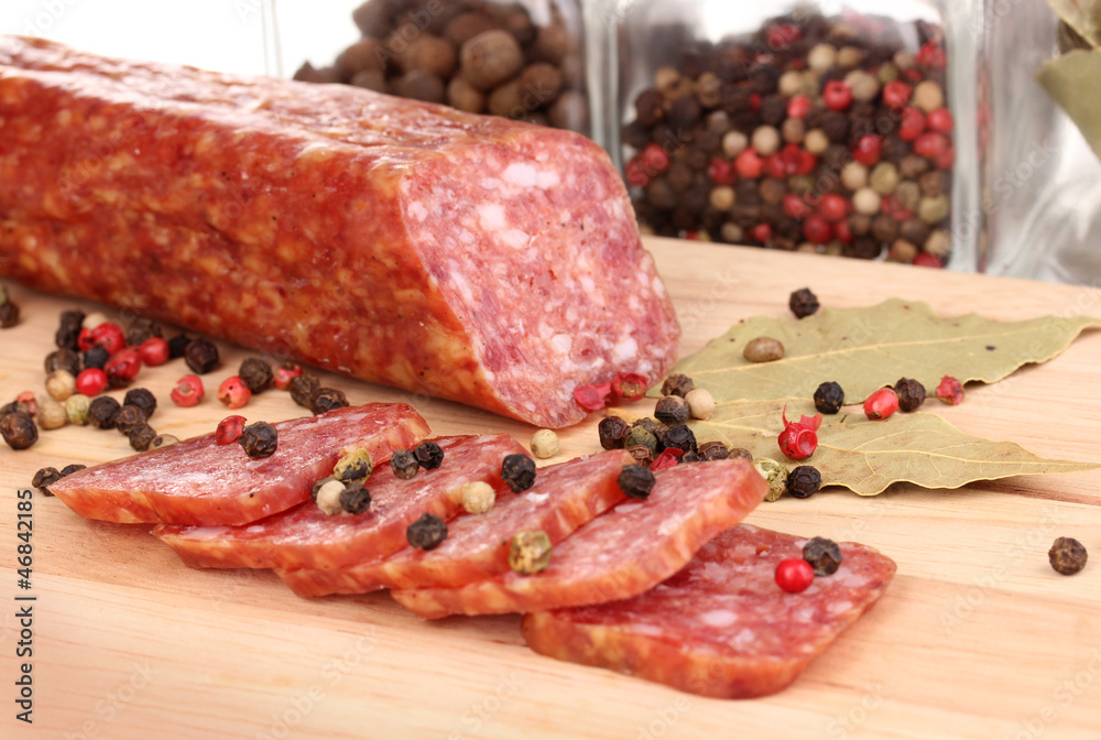 Tasty sausage on chopping board close-up Tasty sausage on chopping board close-up