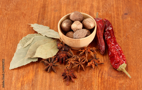 Fototapeta Naklejka Na Ścianę i Meble -  Nutmeg and other spices on wooden background