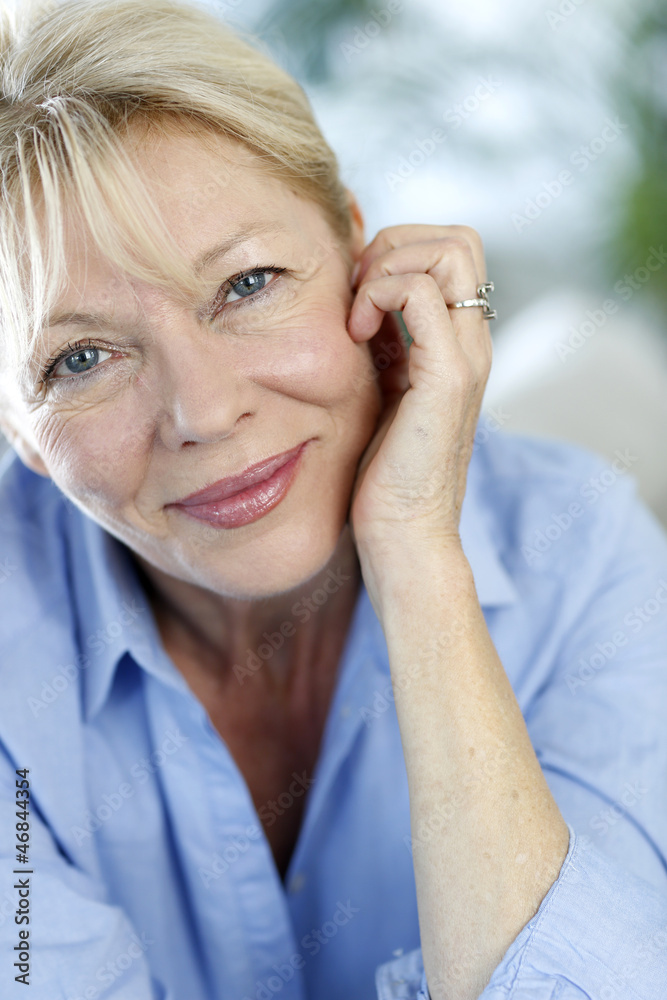Closeup of senior woman with blue shirt Closeup of senior woman with blue shirt