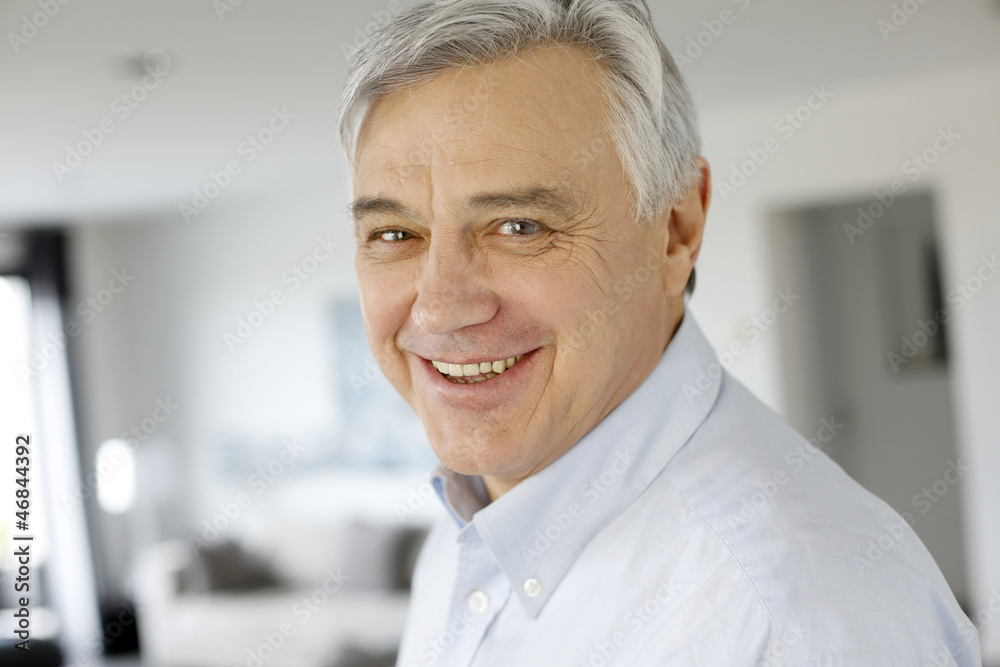 Portrait of serene senior man looking at camera Portrait of serene senior man looking at camera