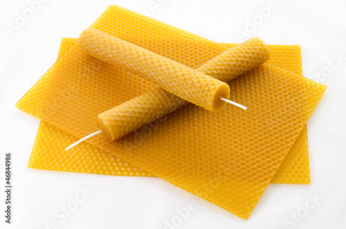 two Candle made of beeswax on honeycomb - background photo