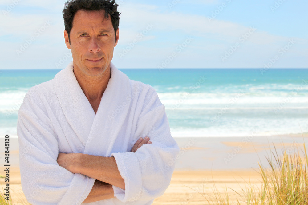 Man on the beach in bath robes