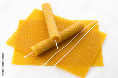 two Candle made of beeswax on honeycomb - background