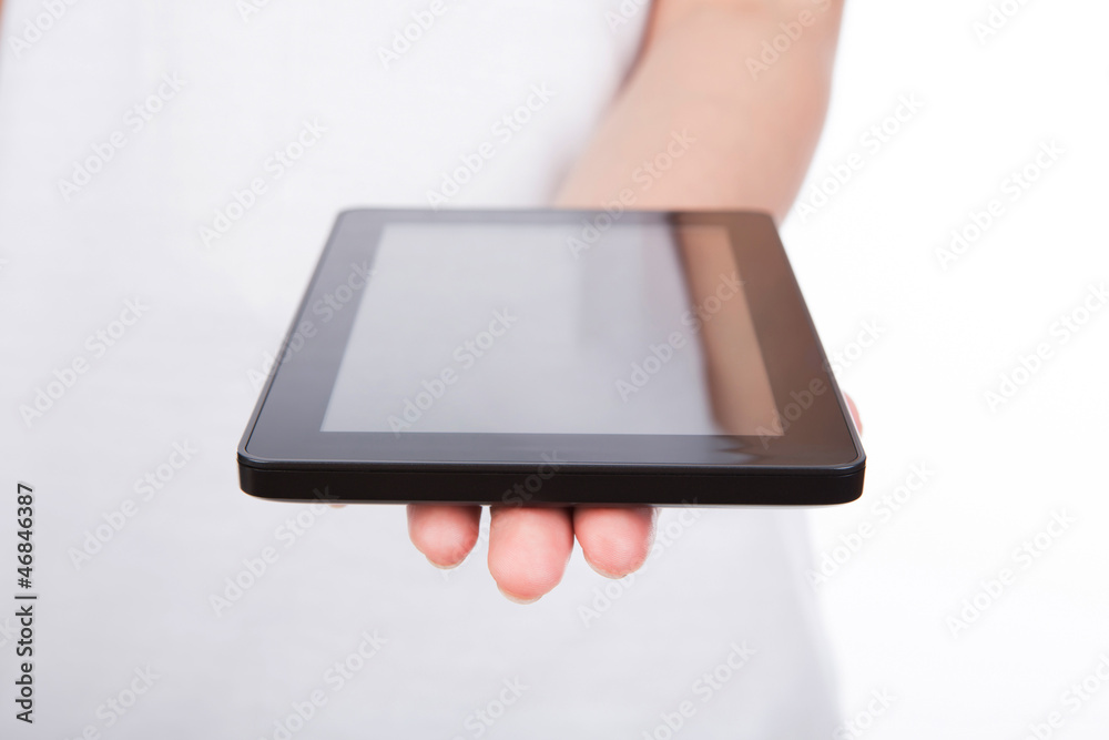 Woman hand using a touch screen device against white background Woman hand using a touch screen device against white background
