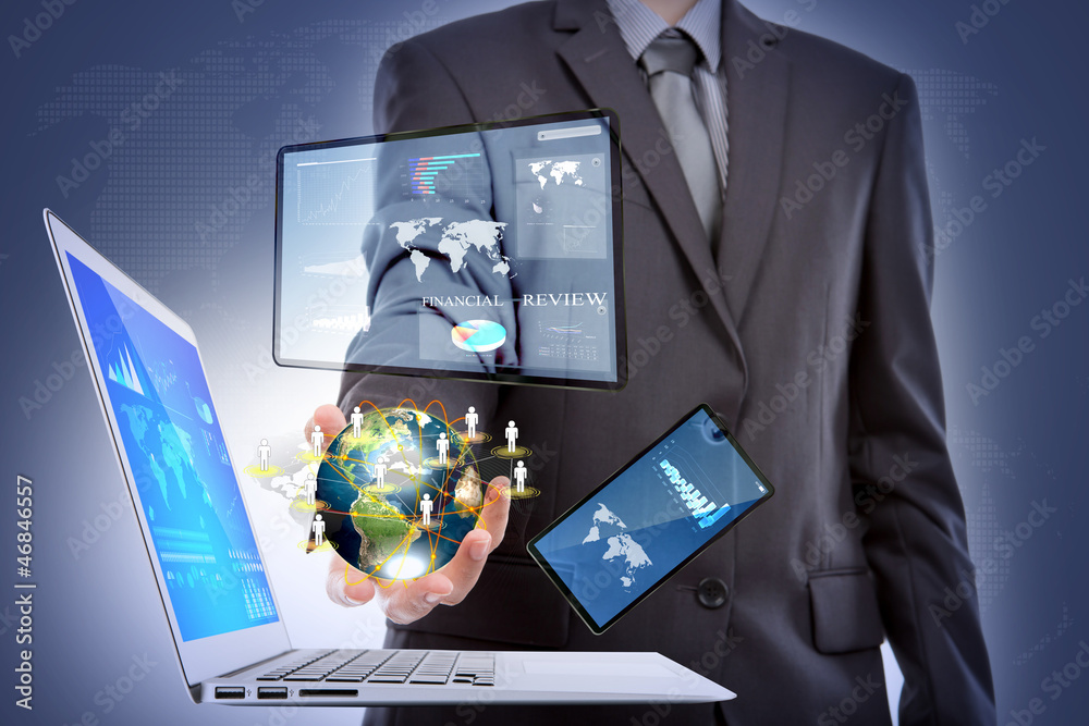 Business man with laptop,mobile phone,touch screen device (Elem Business man with laptop,mobile phone,touch screen device (Elem