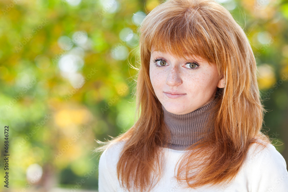 portrait of a beautiful young redhead teenager woman