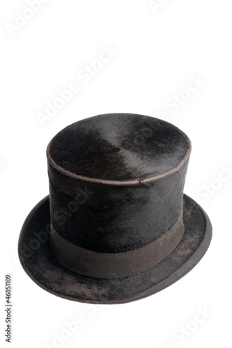 Old black high hat isolated on white background.