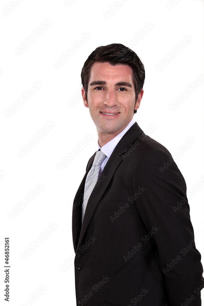 Happy businessman with his hands behind his back Happy businessman with his hands behind his back