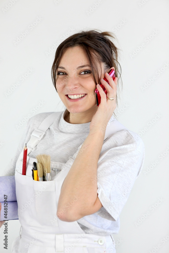 beaming female painter making a call beaming female painter making a call