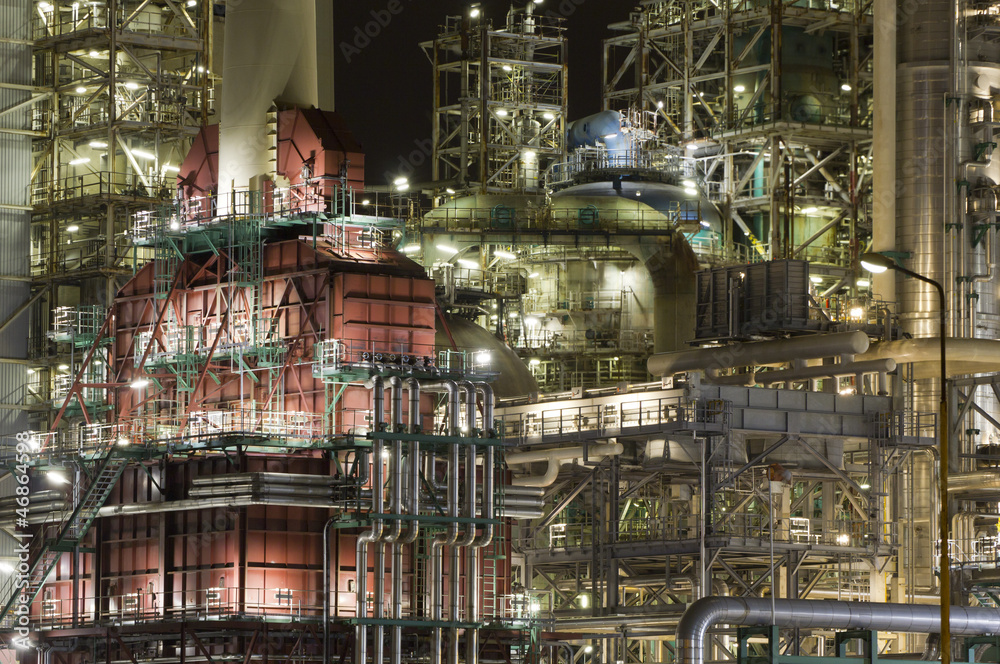 Close-up of a large oil-refinery plant at night
