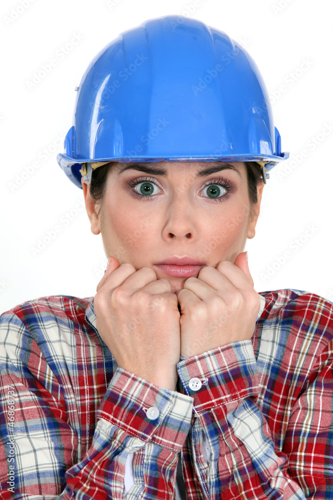 Scared female construction worker Scared female construction worker