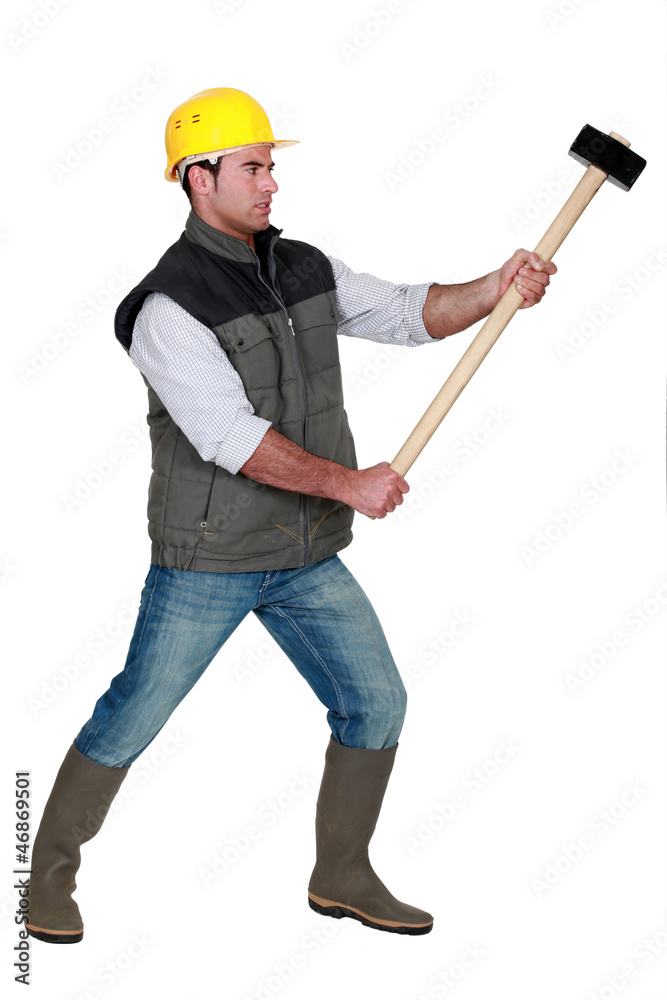 portrait of young carpenter holding hammer portrait of young carpenter holding hammer