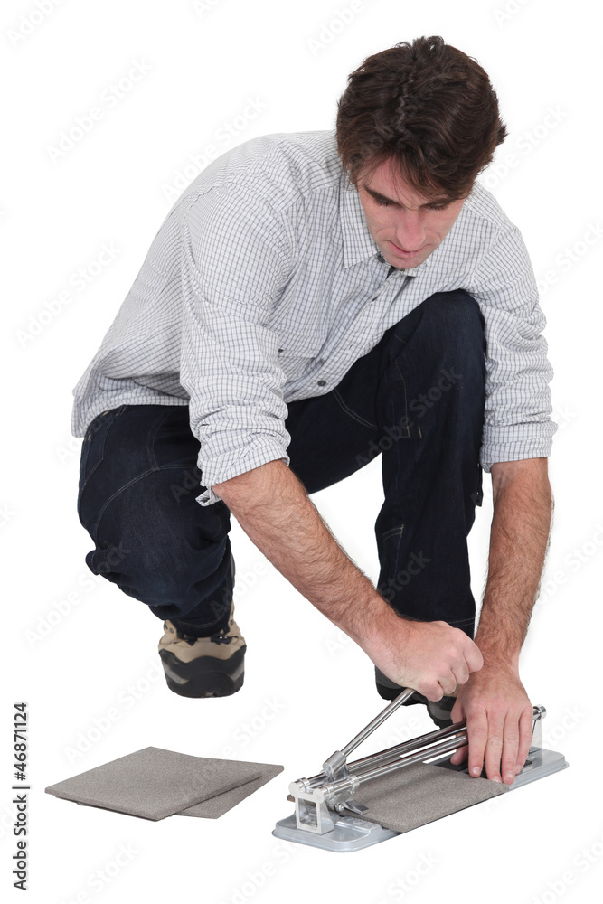 Man cutting tiles Man cutting tiles