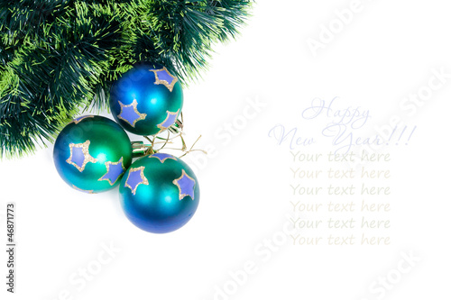 Christmas balls with a pine tinsel isolated on white