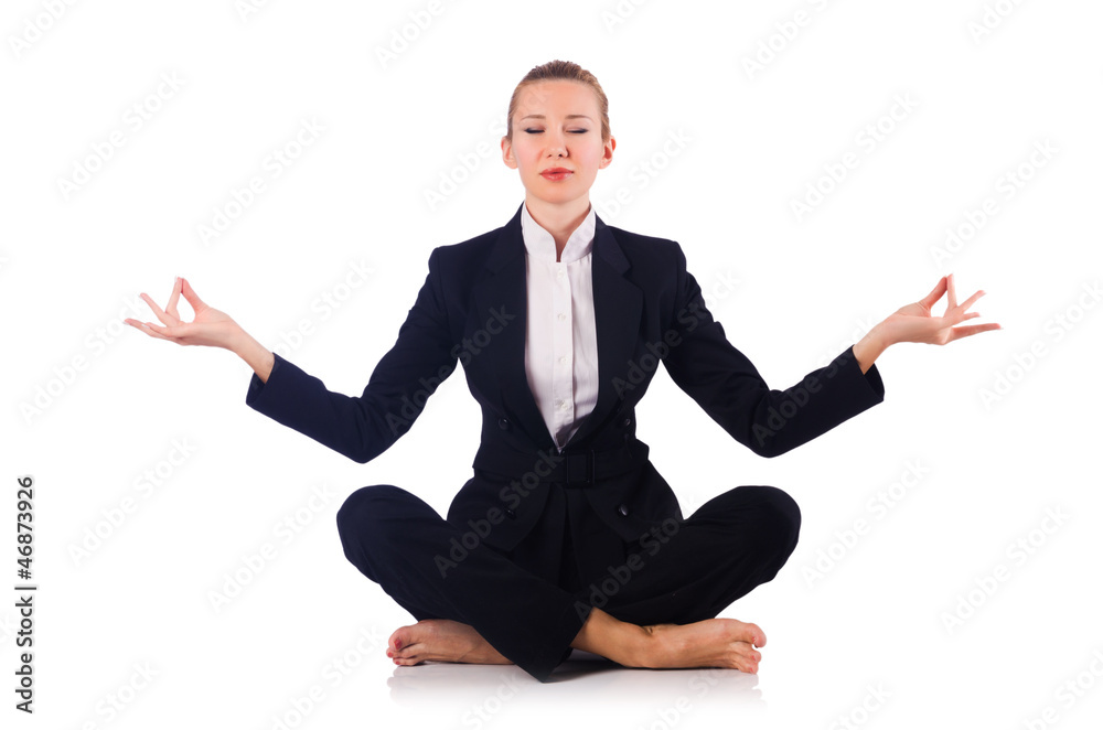 Young businesswoman meditating on the white Young businesswoman meditating on the white