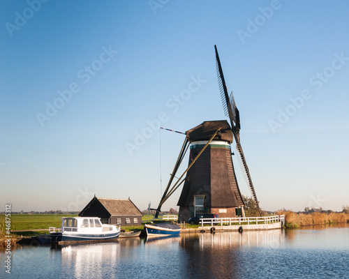 Dutch windmill on the river banks