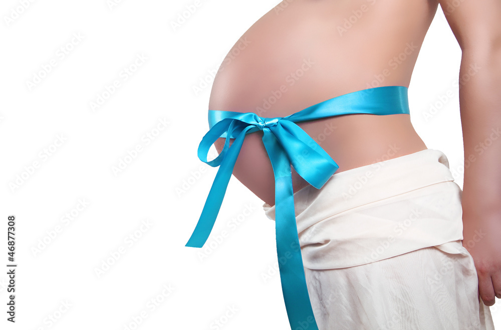 Belly with blue ribbon bow of pregnant woman, isolated over whit Belly with blue ribbon bow of pregnant woman, isolated over whit