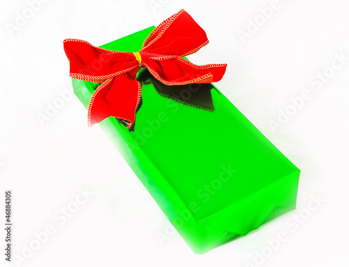 green gift with red ribbon 