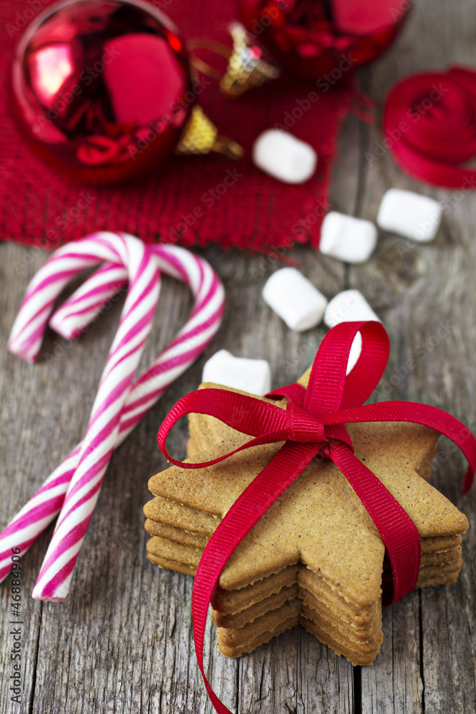 Gingerbread cookies with candy canes and christmas ornaments Gingerbread cookies with candy canes and christmas ornaments