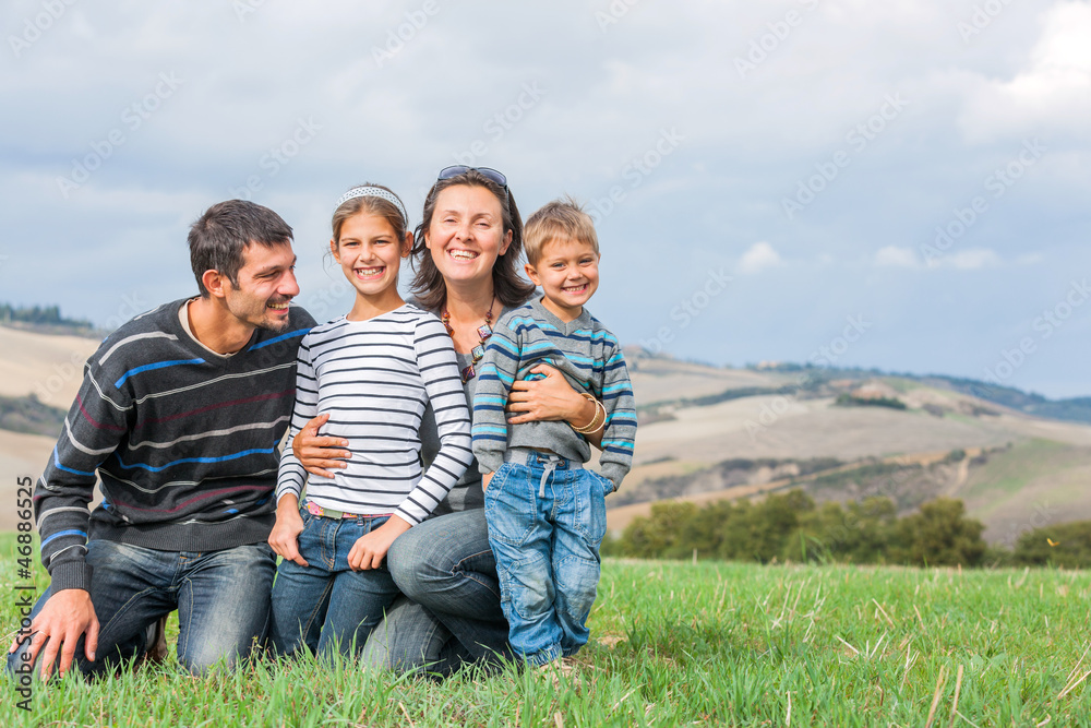 Happy family having fun outdoors in Tuscan Happy family having fun outdoors in Tuscan