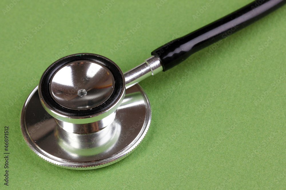 Stethoscope close-up on green background Stethoscope close-up on green background