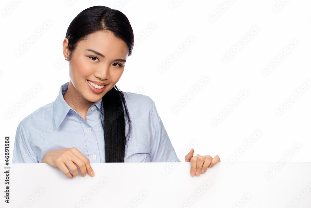 Young Asian lady with a blank sign Young Asian lady with a blank sign
