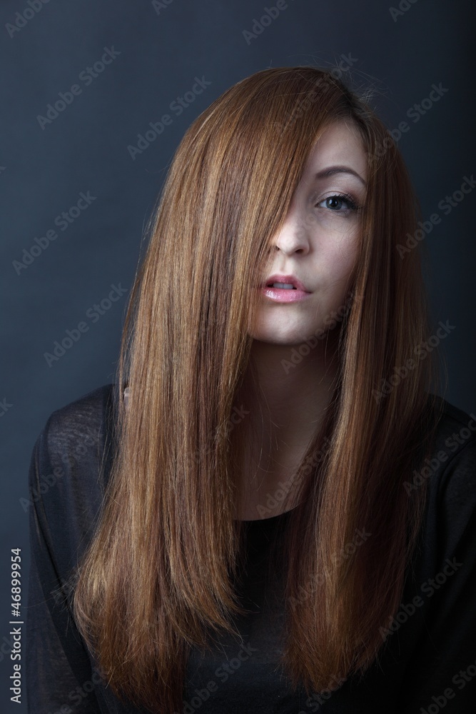 Beautiful young woman with long hair Stock Photo | Adobe Stock