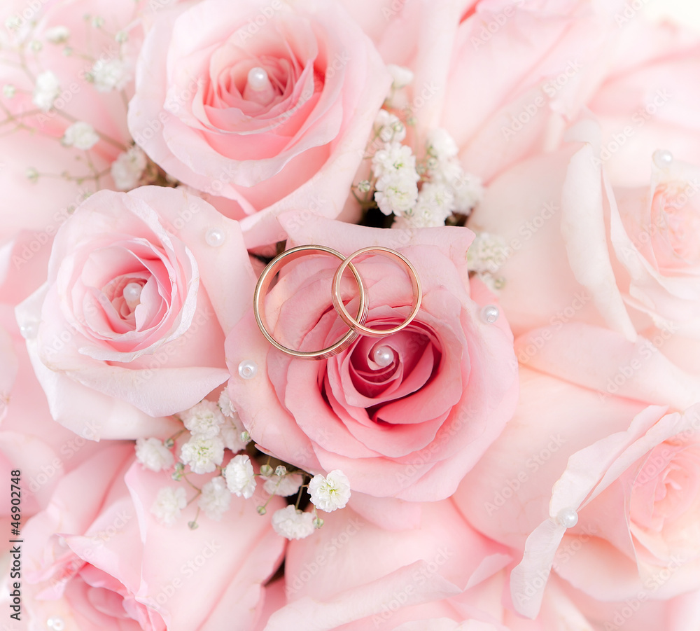 Gold wedding rings on flower . Decorating the wedding ceremony. Gold wedding rings on flower . Decorating the wedding ceremony.