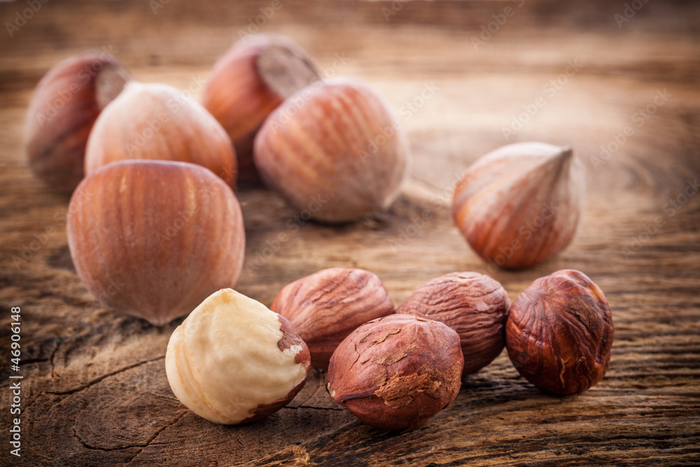 Hazelnuts (filbert) on old wooden table. Close-up Hazelnuts (filbert) on old wooden table. Close-up