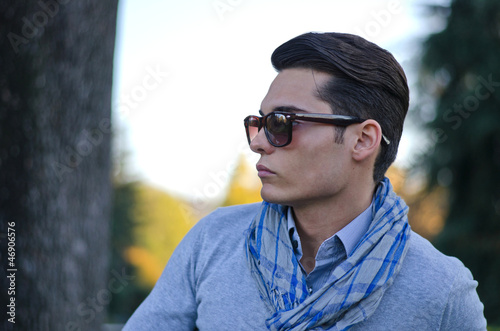 Good looking young man in evening light, during fall season © theartofphoto