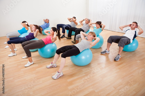 Class of diverse people doing pilates