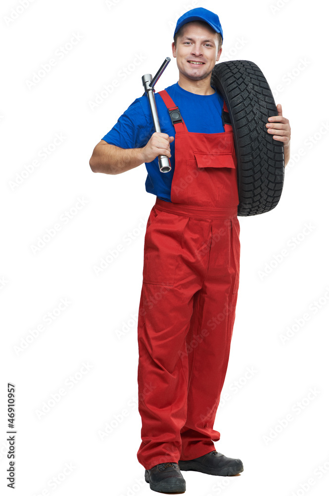 automobile mechanic with car tire and spanner