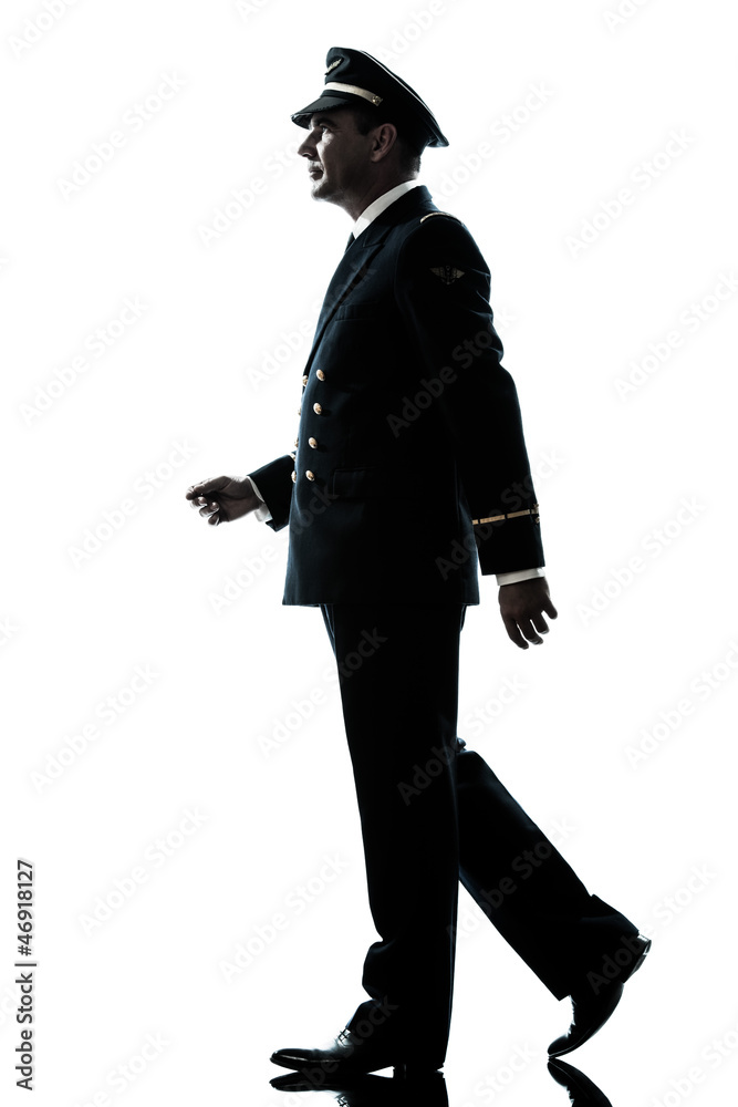 man in airline pilot uniform silhouette walking man in airline pilot uniform silhouette walking