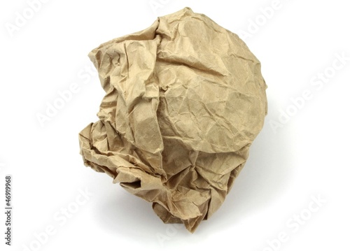 Crumpled brown paper on white background.