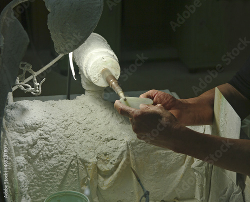 hands engraving stone