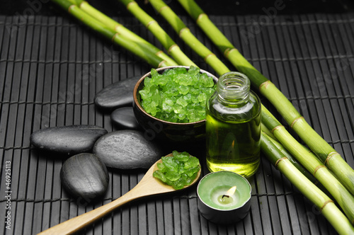 Bamboo grove and salt in bowl with candle