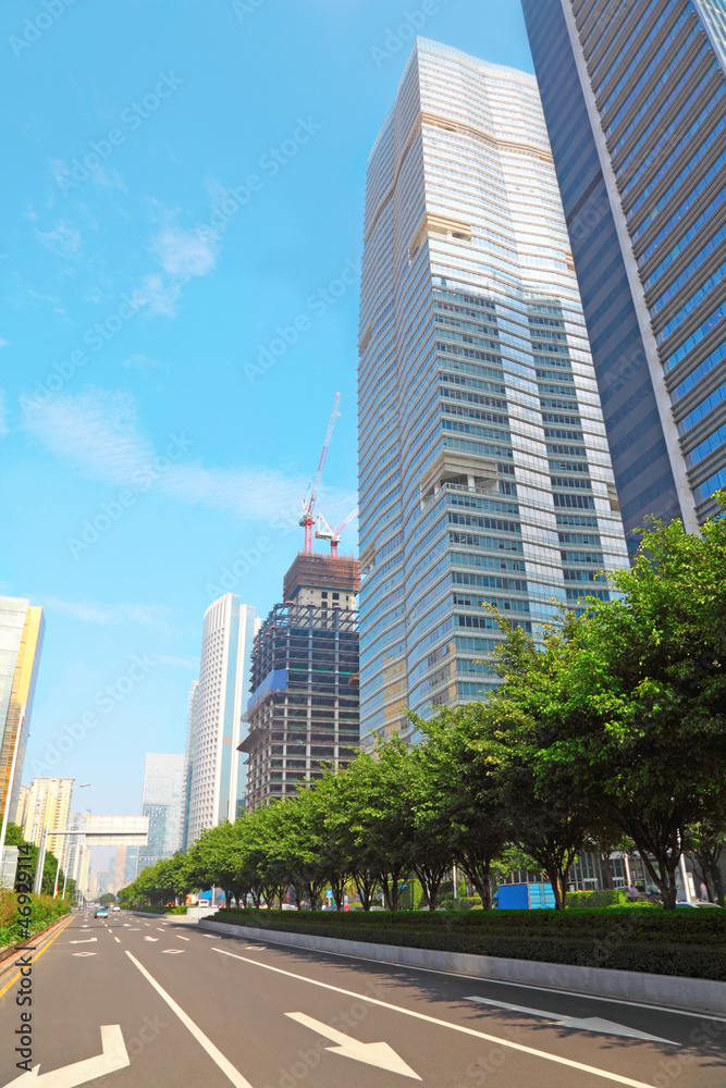 Green leaves are over highway  in Guangzhou, China.