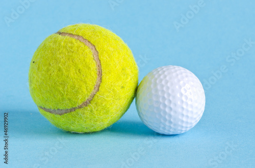 golf and tennis balls on azure background