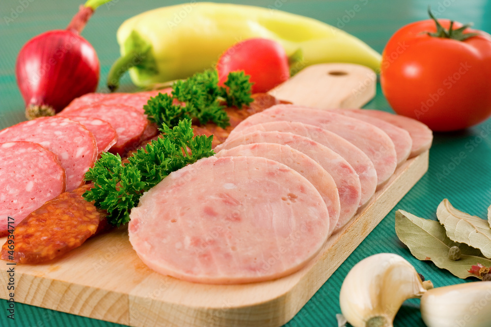 Salami and sausage slices and vegetables Salami and sausage slices and vegetables