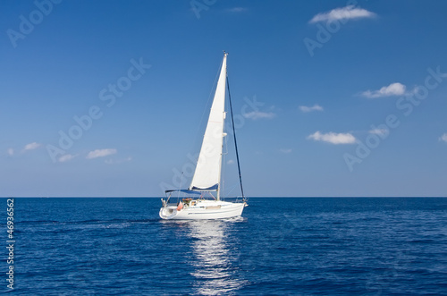 White sailboat in mediterranean sea
