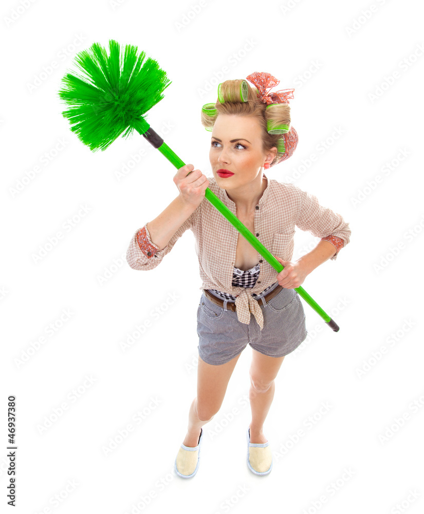 Funny cheerful housewife / girl with broom, isolated on white Funny cheerful housewife / girl with broom, isolated on white