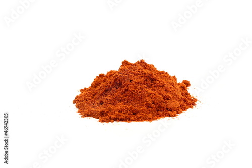 Red paprika powder on white