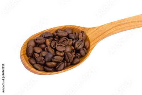 Wooden spoon with coffee beans