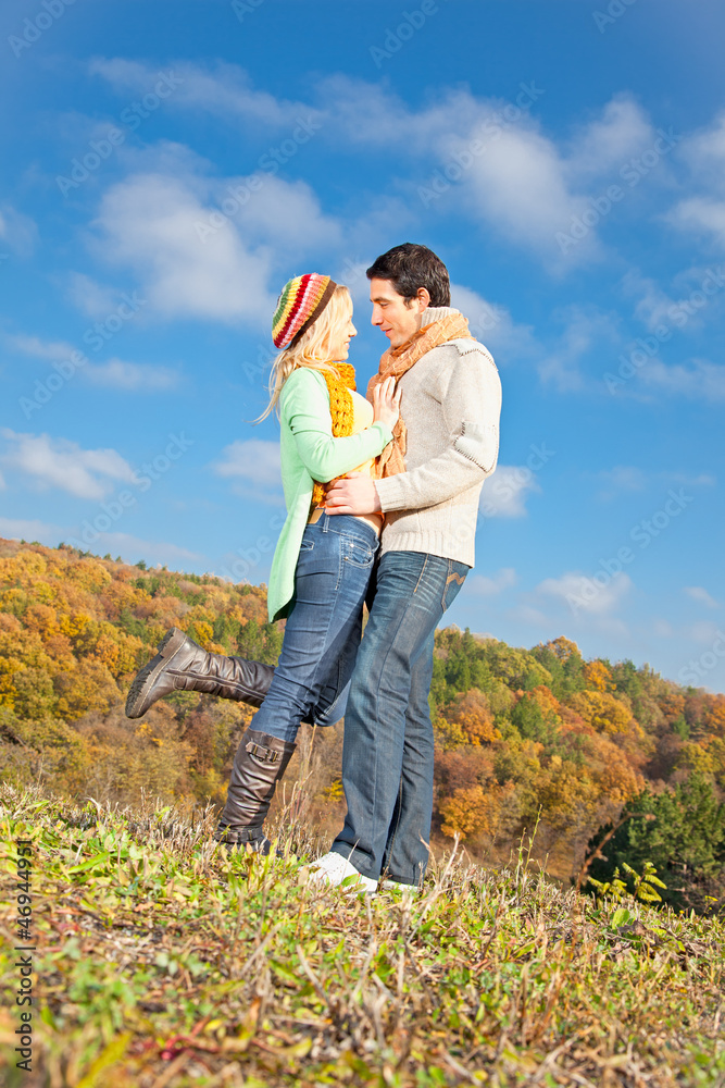 Happy young couple spending time outdoor in the park